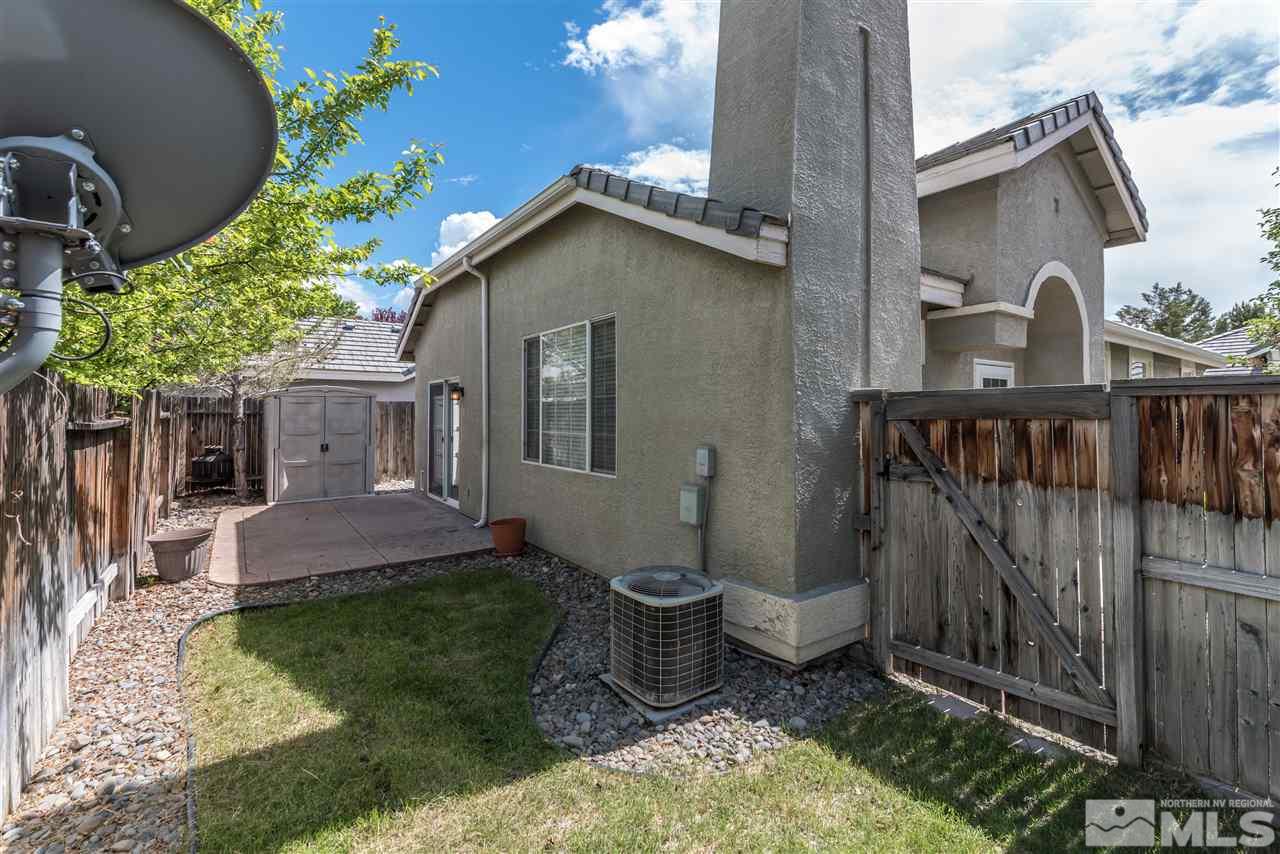 9724 Ripple Way Reno, NV 89521 - Photo 16 of 19 a view of a patio with table and chairs and potted plants