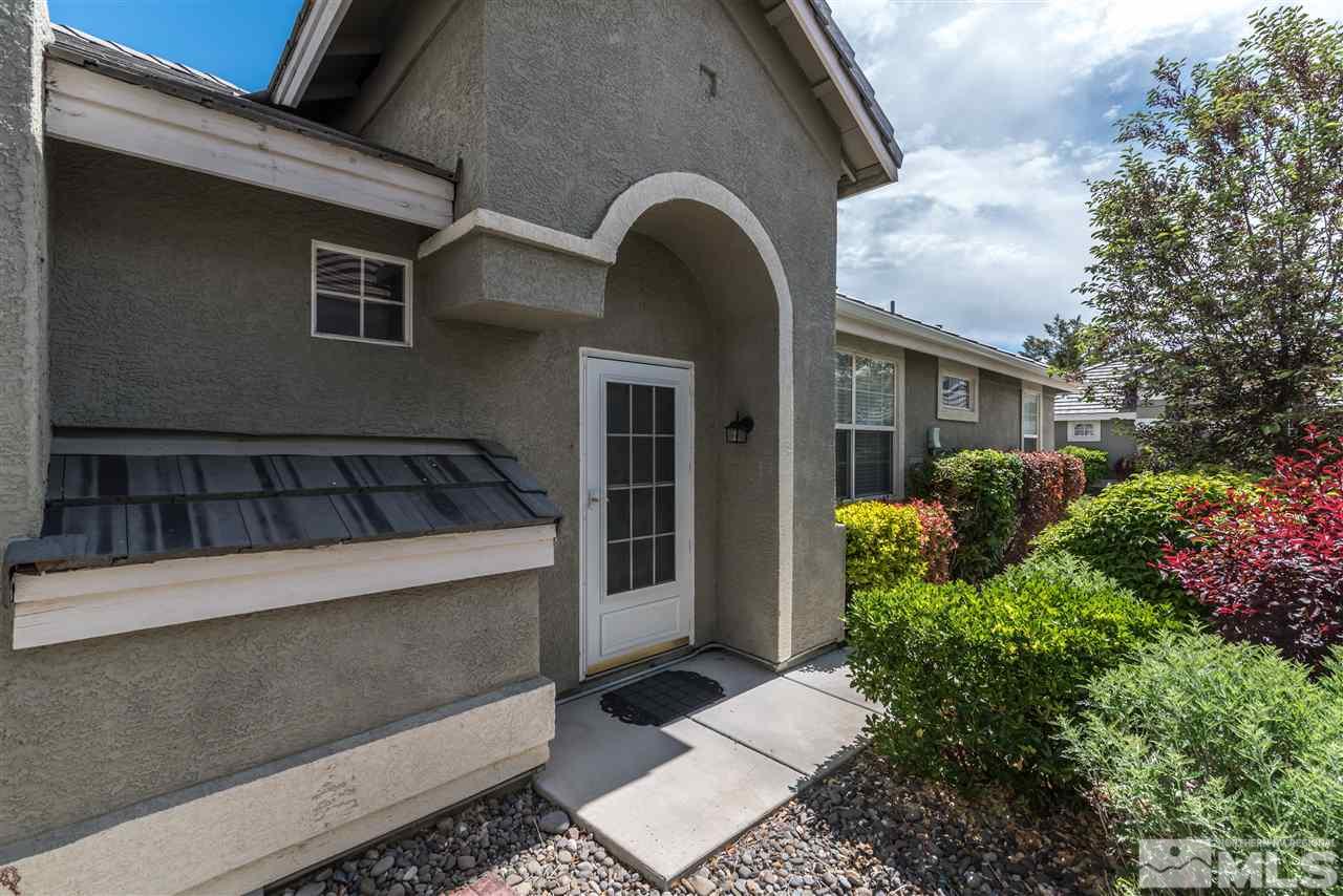 9724 Ripple Way Reno, NV 89521 - Photo 3 of 19 a front view of a house with a garden