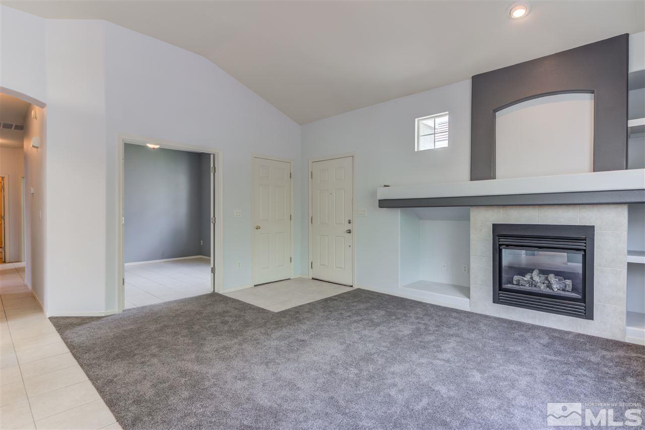 9724 Ripple Way Reno, NV 89521 - Photo 4 of 19 a view of an empty room and fire place