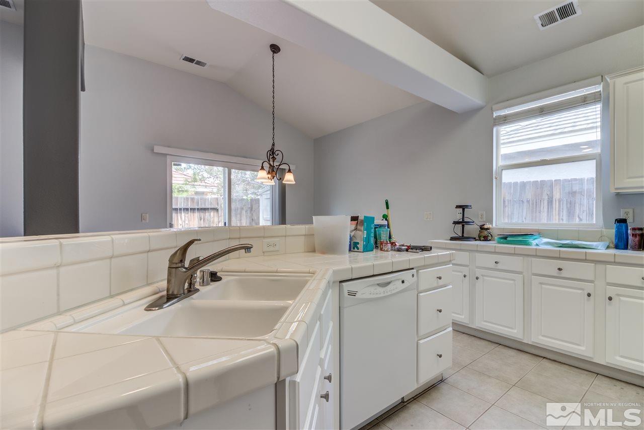 9724 Ripple Way Reno, NV 89521 - Photo 10 of 19 a kitchen with a sink and cabinets