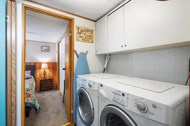 a utility room with dryer and washer