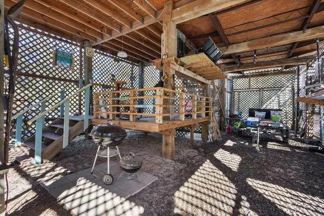 a view of a chairs and table in a patio