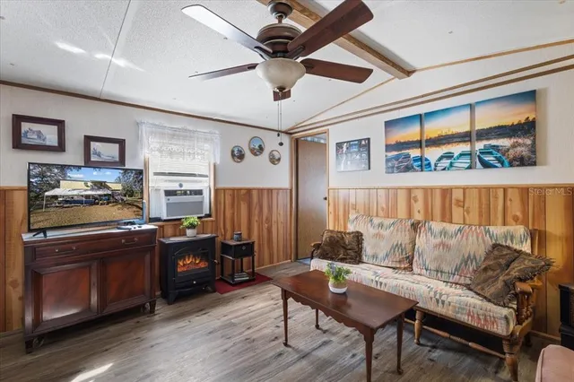 a living room with furniture and a window