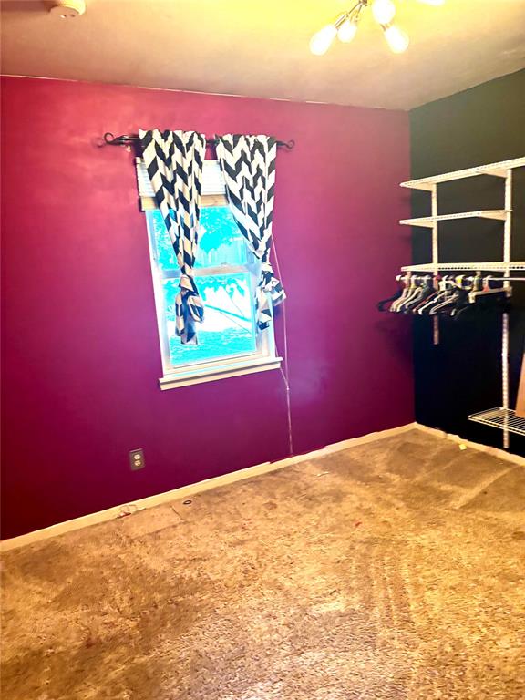 1326 Texas Street Vernon, TX 76384 - Photo 15 of 25 Carpeted empty room with baseboards