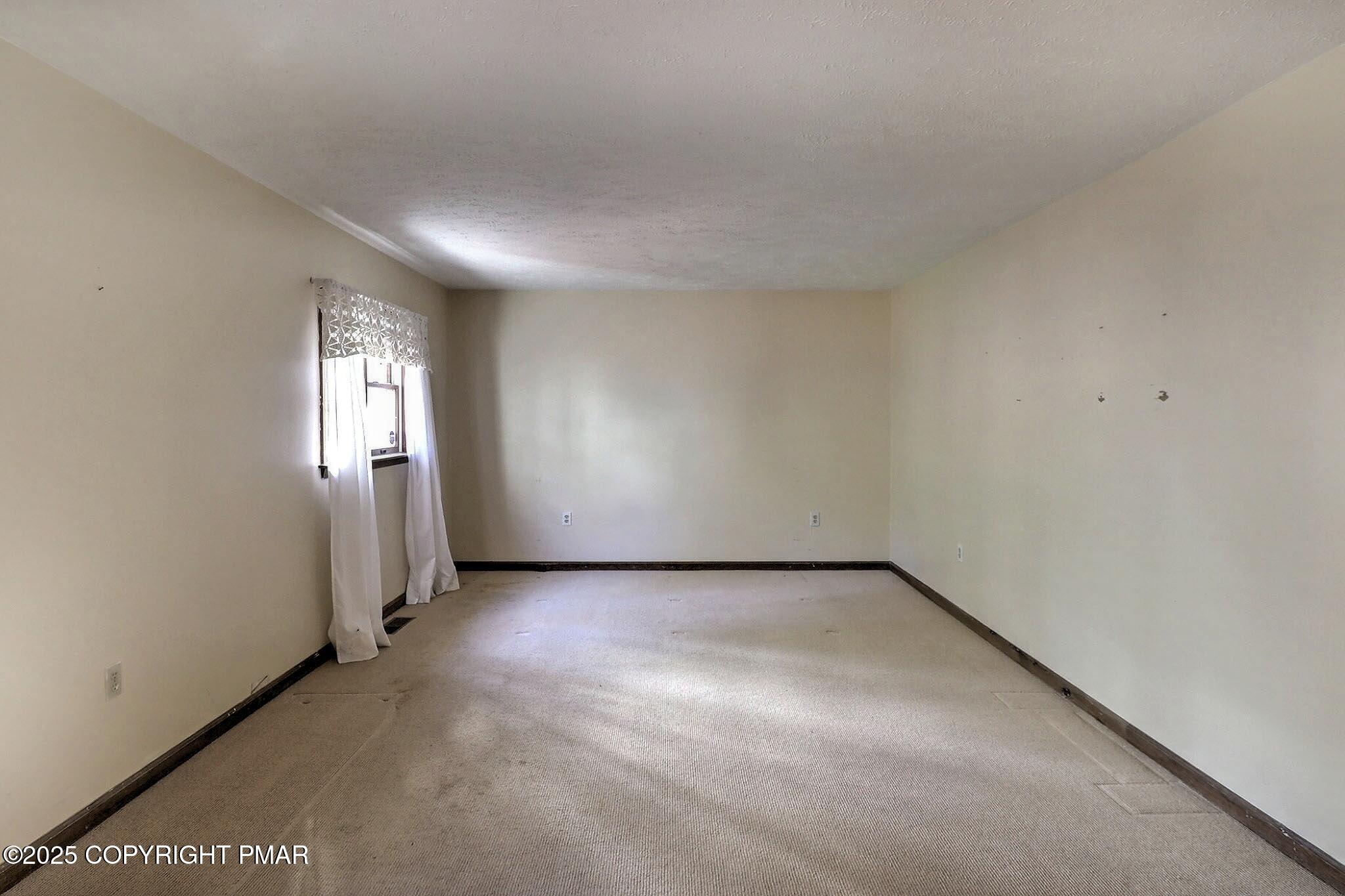 641 Long Mountain Road Effort, PA 18330 - Photo 16 of 41 an empty room with windows and closet