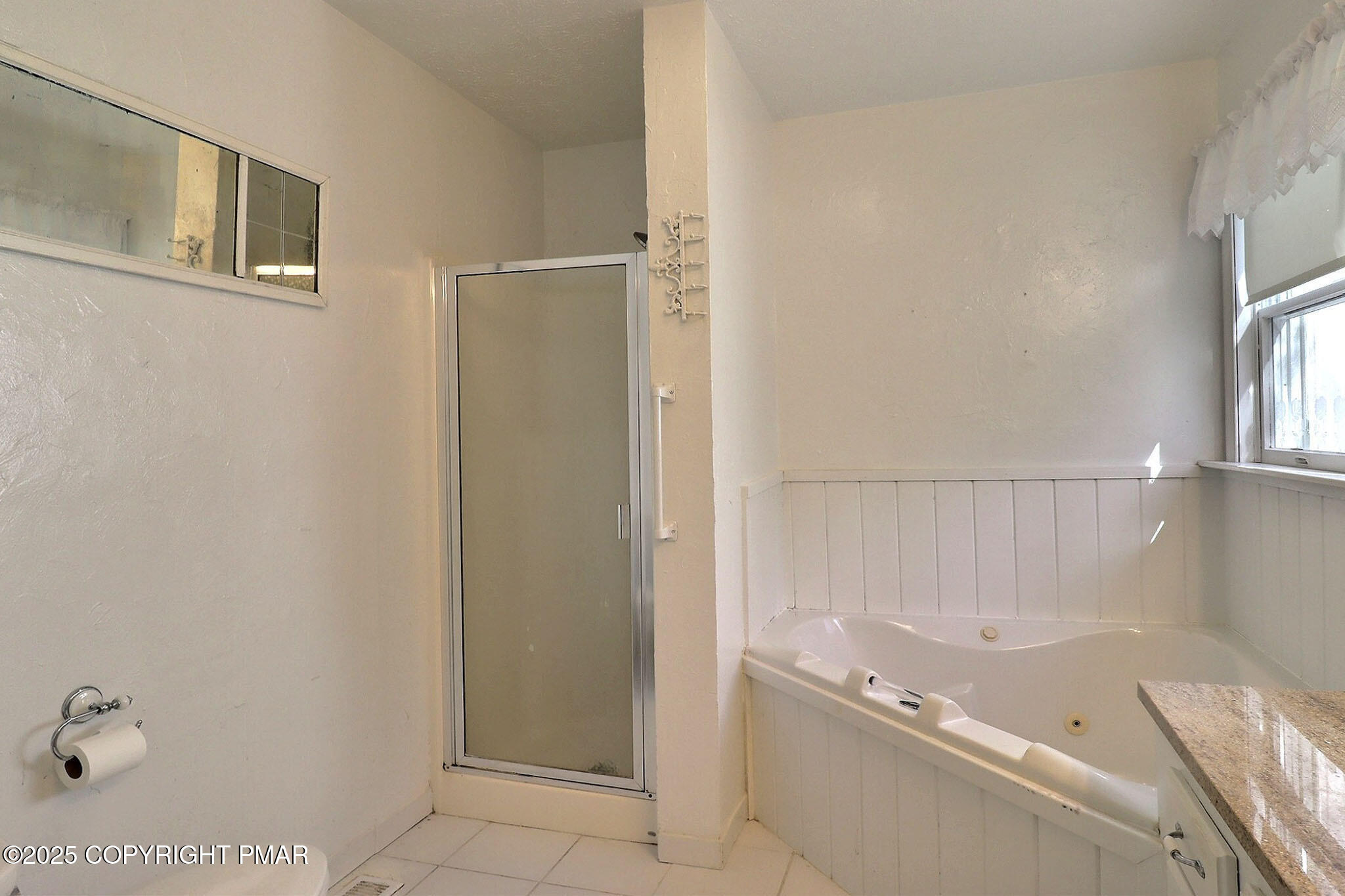 641 Long Mountain Road Effort, PA 18330 - Photo 19 of 41 a bathroom with a tub and a shower