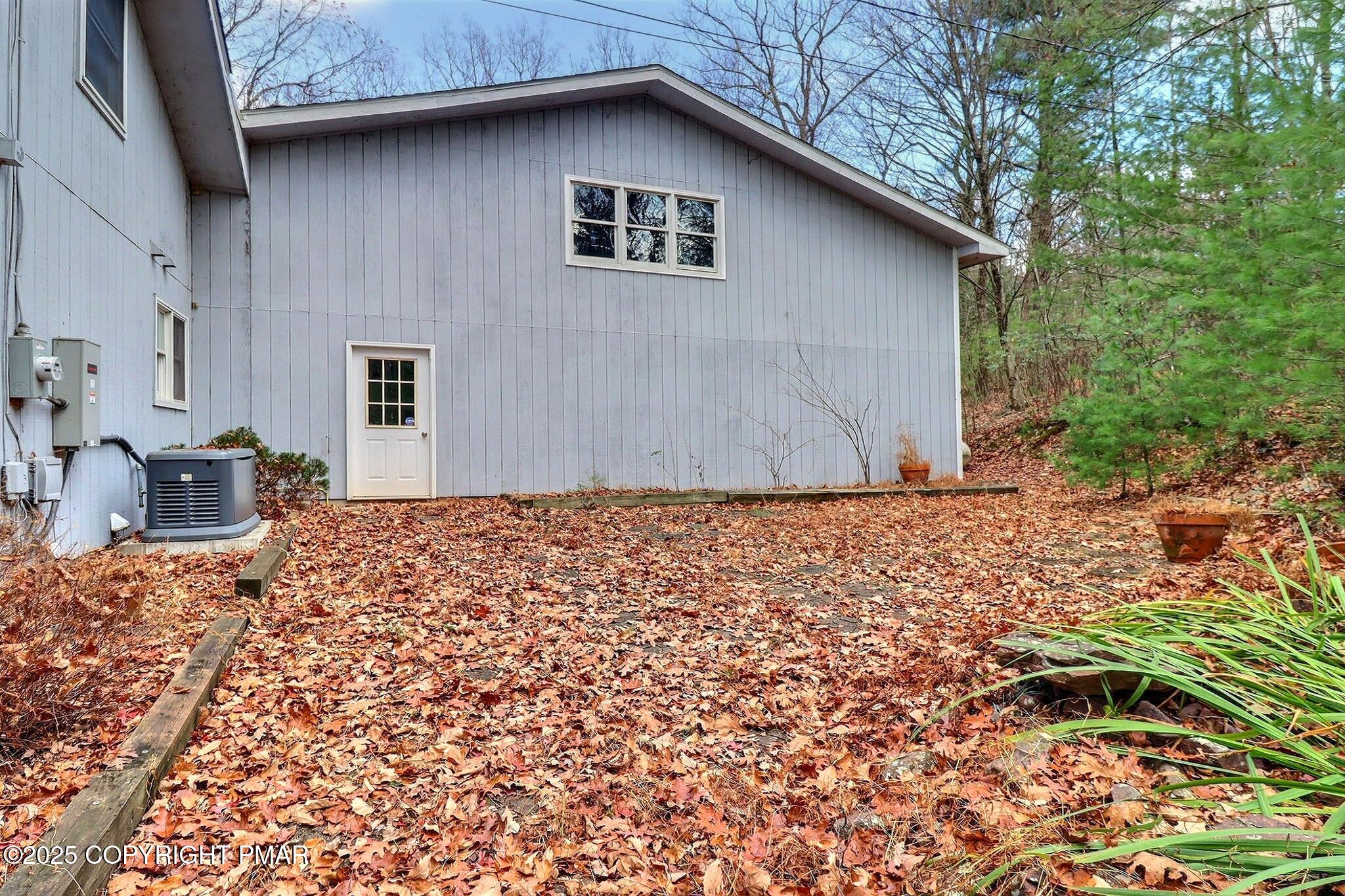 641 Long Mountain Road Effort, PA 18330 - Photo 6 of 41 a backyard of a house with table and chairs