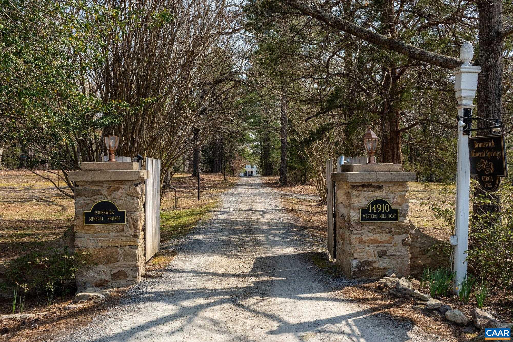 14910 Western Mill Road Lawrenceville, VA 23868 - Photo 10 of 73 a view of entrance gate of a house with yard and outdoor seating