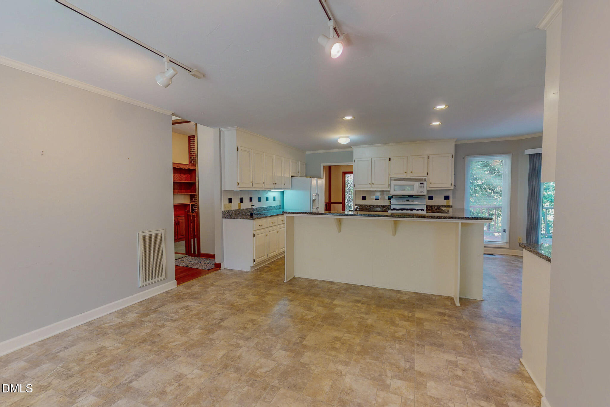 11 Denada Path Roxboro, NC 27574 - Photo 14 of 62 a kitchen with stainless steel appliances granite countertop a refrigerator sink and cabinets