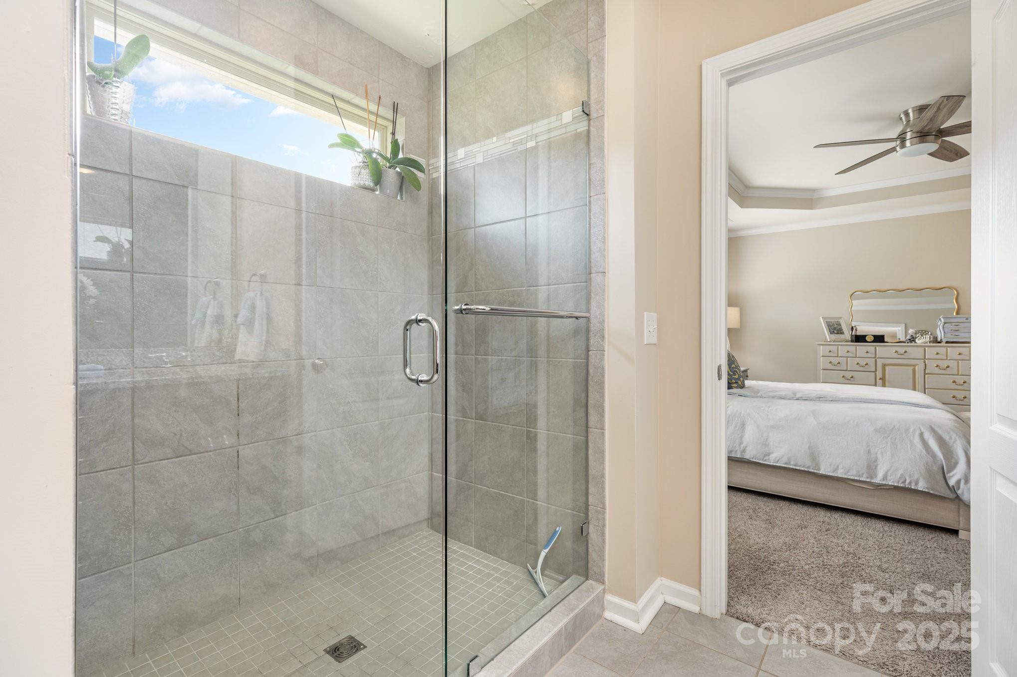 6006 Cadence Lane Fort Mill, SC 29707 - Photo 11 of 19 a bathroom with a shower and a sink a mirror