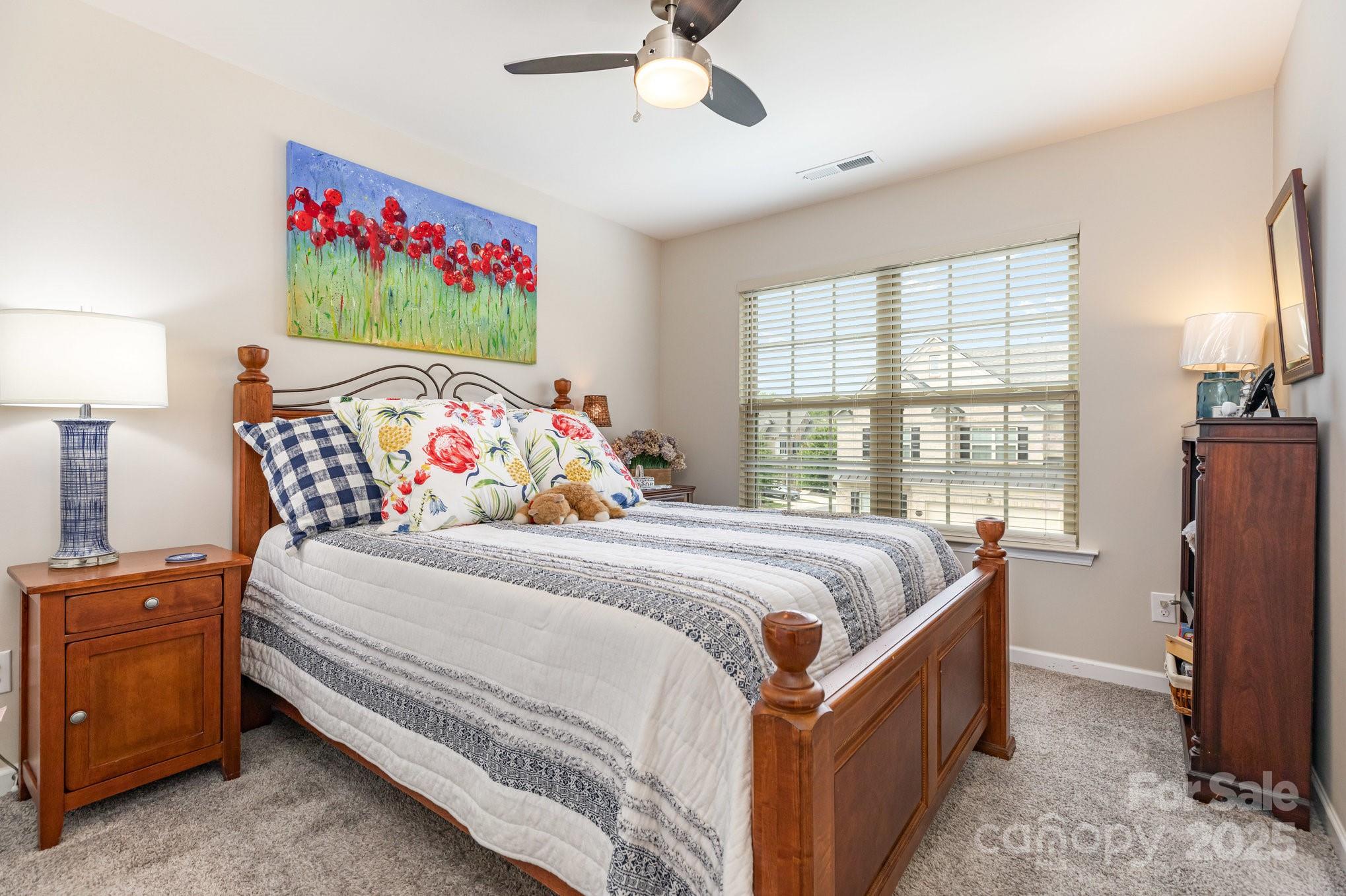 6006 Cadence Lane Fort Mill, SC 29707 - Photo 15 of 19 a bed sitting in a bedroom next to a window