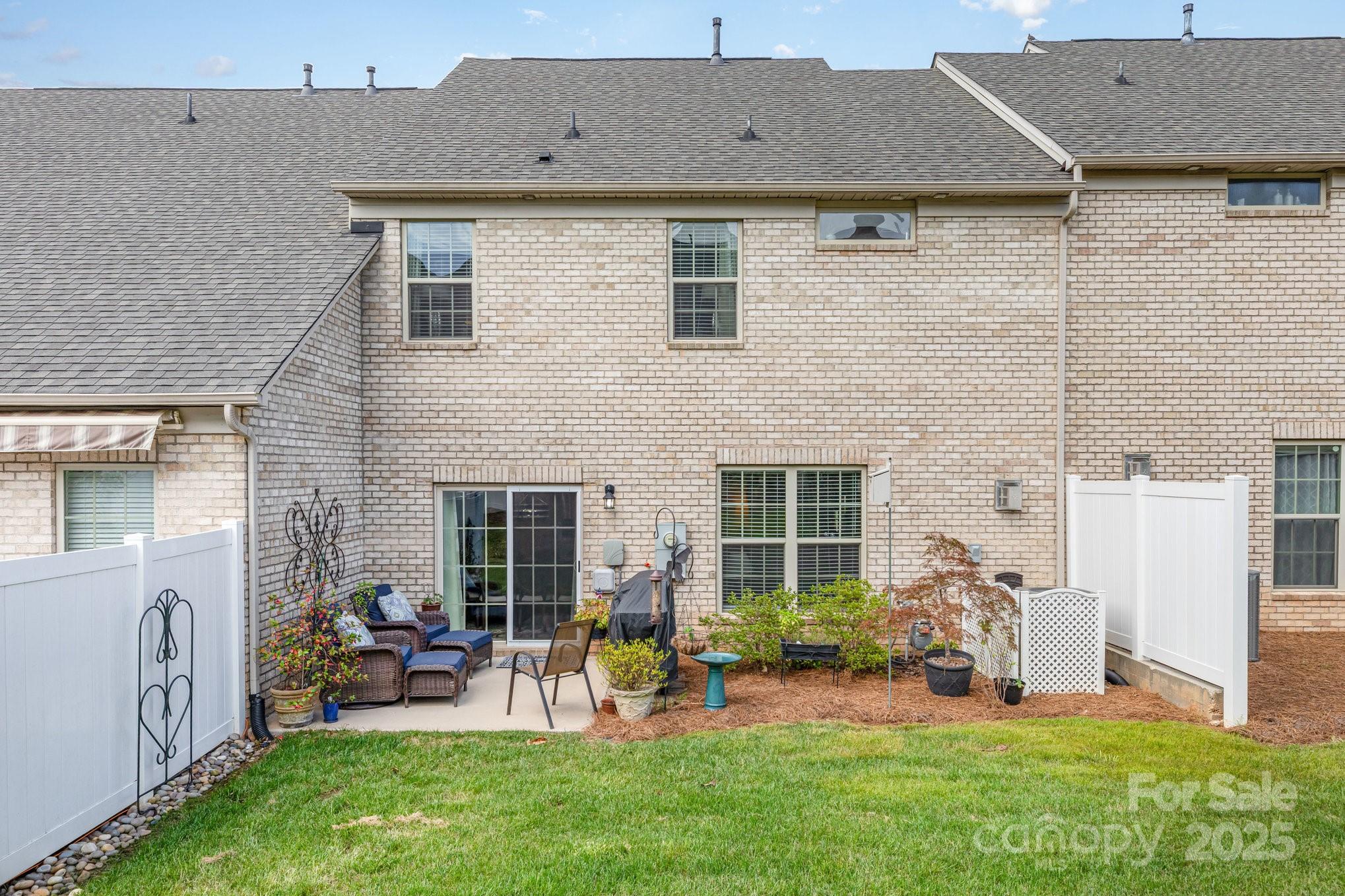 6006 Cadence Lane Fort Mill, SC 29707 - Photo 19 of 19 a view of a house with backyard sitting area and furniture