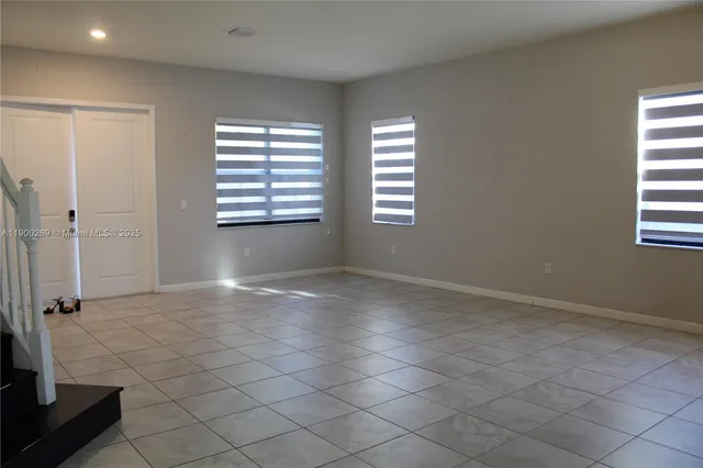 an aerial view of a houses with yard