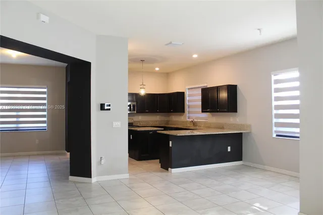 a view of a living room and yard