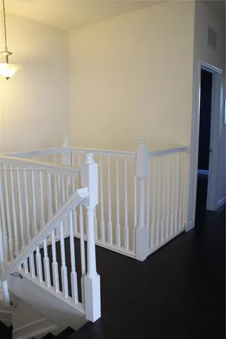 a room with gym equipment and a large window