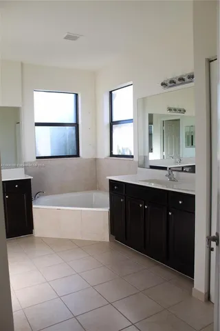 a view of a backyard with large trees