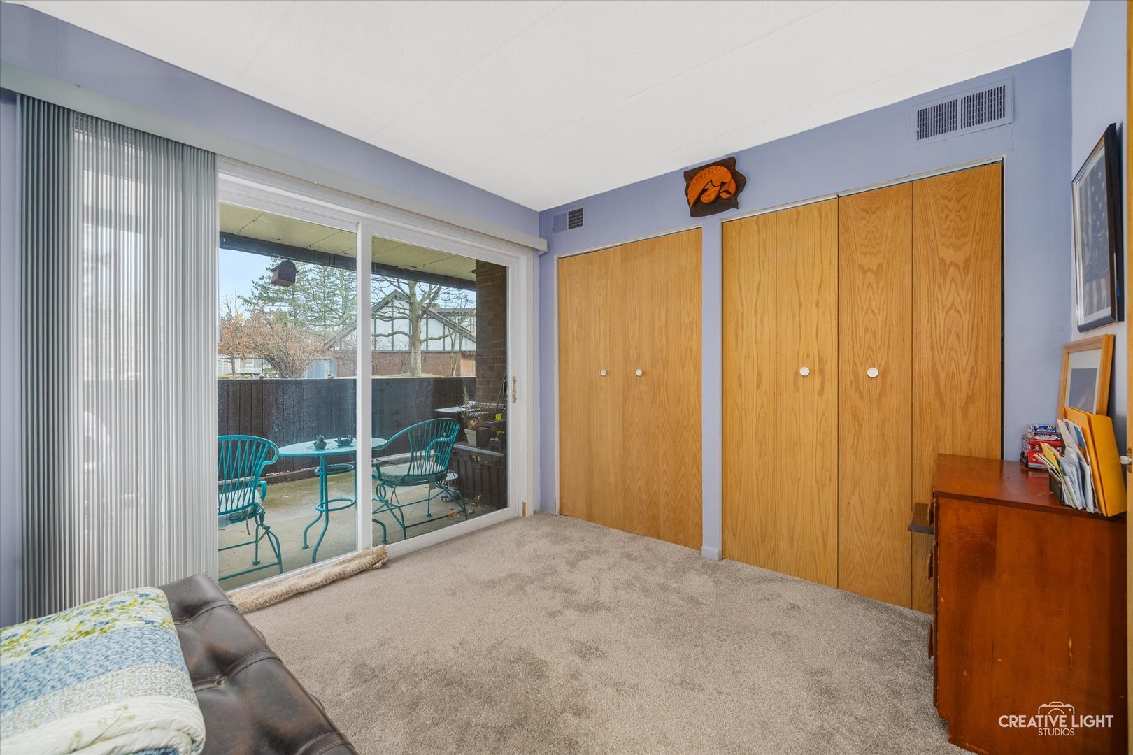 491 Timber Ridge Drive, Unit 102 Carol Stream, IL 60188 - Photo 12 of 18 a bedroom with a bed and large windows