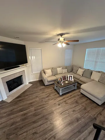 a living room with furniture and a flat screen tv