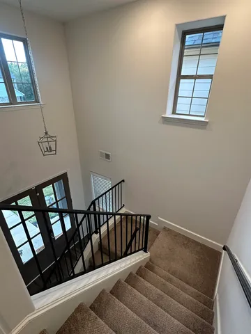 a view of entryway with stairs and wooden floor