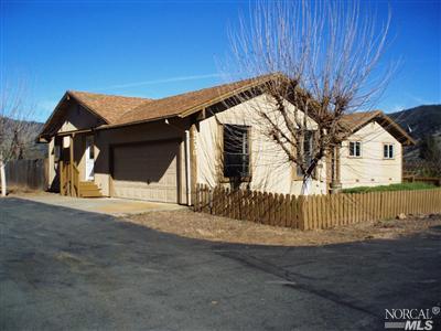 2230 Rd H Redwood Valley, CA 95470 - Photo 1 of 1 a front view of a house with a garage