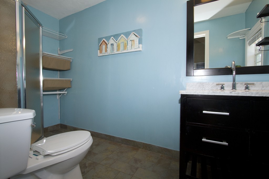 2 Campbell Road Middleton, MA 01949 - Photo 25 of 30 a bathroom with a toilet a sink and mirror