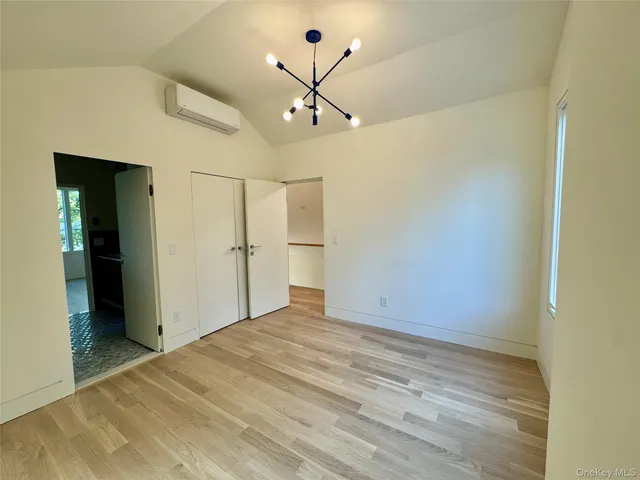 a bathroom with a sink double vanity and a mirror