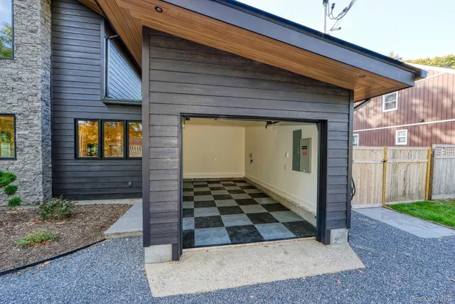 a view of empty room with wooden floor and window
