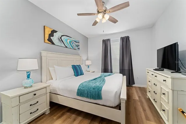 a view of a room with a bed and a window