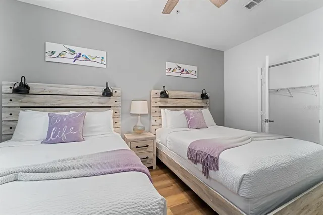 a bed sitting in a bedroom and lamp