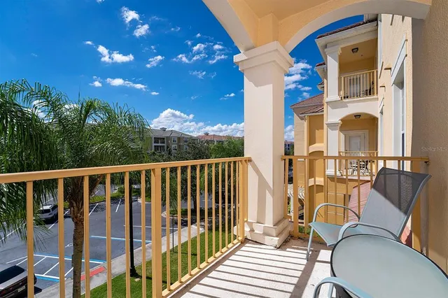 an aerial view of a house with garden space and street view