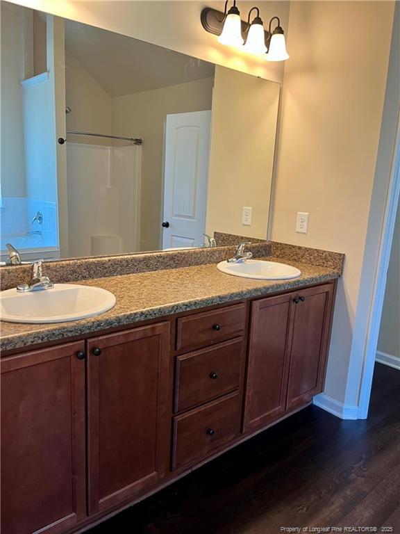 54 Inlet View Sanford, NC 27332 - Photo 18 of 25 a bathroom with a granite countertop sink and a mirror