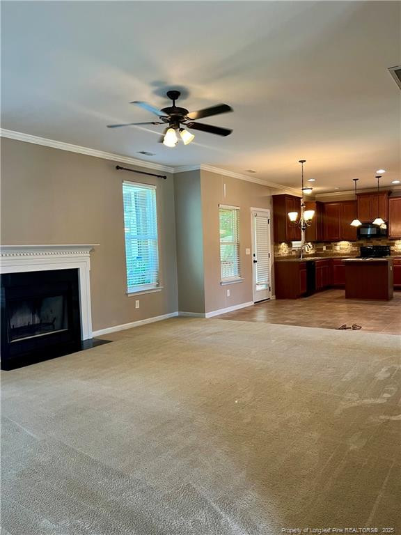 54 Inlet View Sanford, NC 27332 - Photo 7 of 25 a view of an empty room with a fireplace and a ceiling fan
