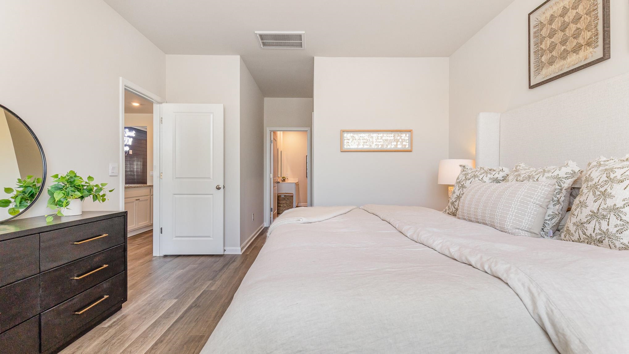 319 Ridley Street Longs, SC 29568 - Photo 20 of 30 Bedroom with ensuite bath and light wood-style flooring