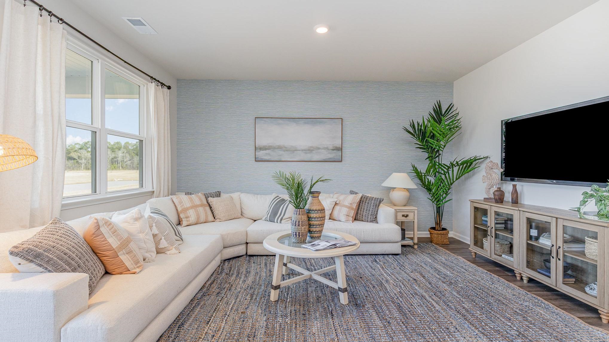 319 Ridley Street Longs, SC 29568 - Photo 6 of 30 Living area with an accent wall, wood finished floors, and recessed lighting