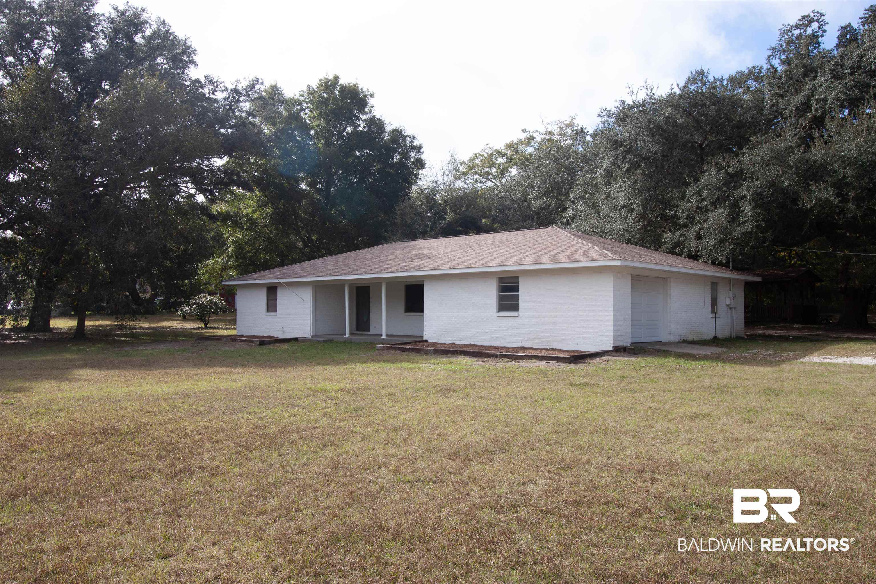 9565 Hildreth Drive Elberta, AL 36530 - Photo 1 of 15 Ranch-style home with a front lawn and brick siding