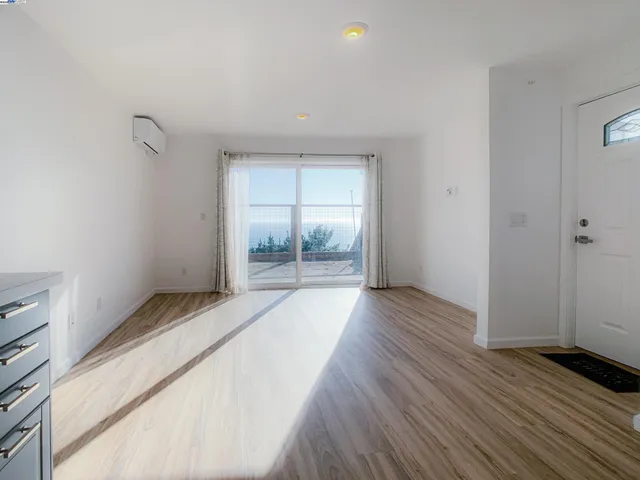 a view of an empty room and window