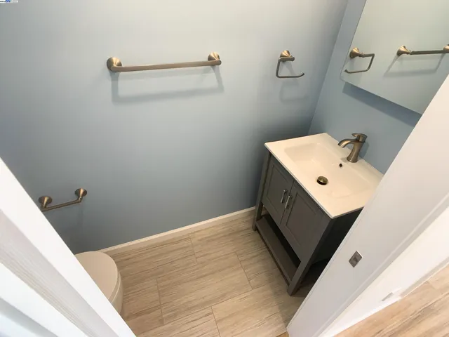 a bathroom with a sink and mirror