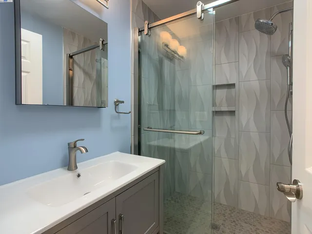 a bathroom with a sink and mirror