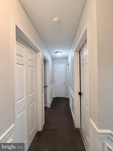 an empty room with a empty space and windows