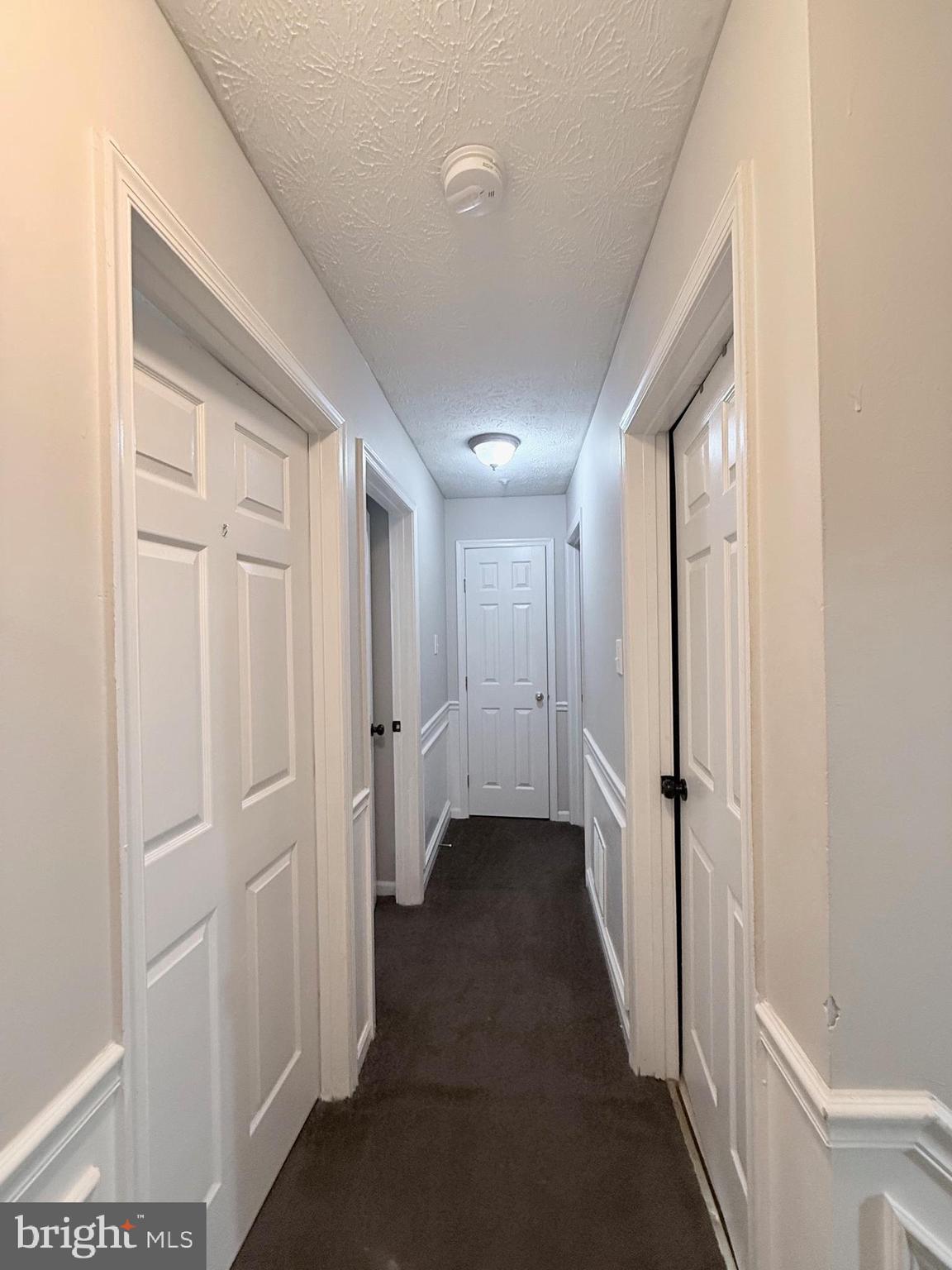 9216 Leigh Choice Court, Unit 10 Owings Mills, MD 21117 - Photo 13 of 32 a view of a hallway with a closet
