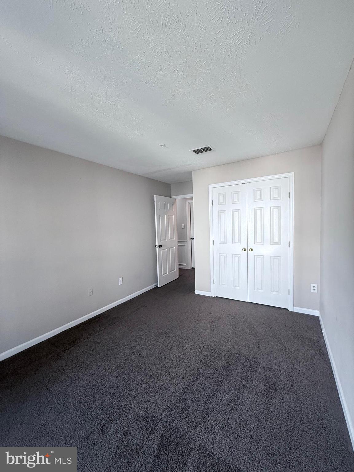 9216 Leigh Choice Court, Unit 10 Owings Mills, MD 21117 - Photo 16 of 32 a view of an empty room with a window