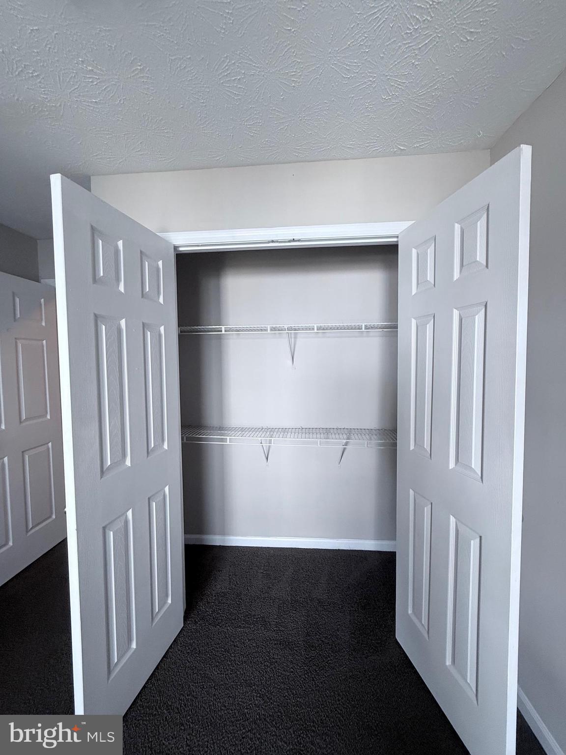 9216 Leigh Choice Court, Unit 10 Owings Mills, MD 21117 - Photo 17 of 32 a view of empty room with windows