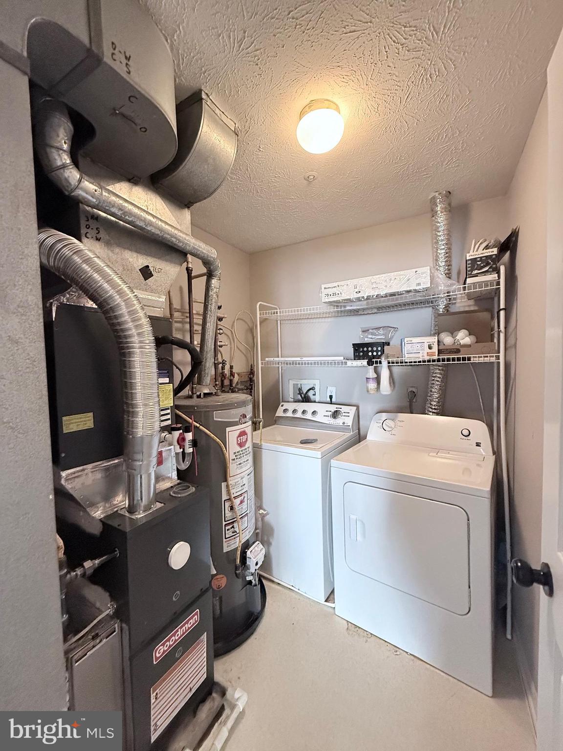 9216 Leigh Choice Court, Unit 10 Owings Mills, MD 21117 - Photo 18 of 32 a view of storage and utility room with washer and dryer