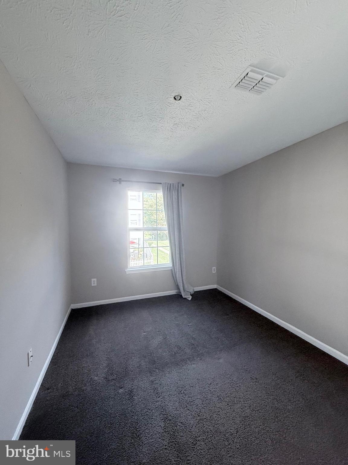 9216 Leigh Choice Court, Unit 10 Owings Mills, MD 21117 - Photo 19 of 32 an empty room with a window