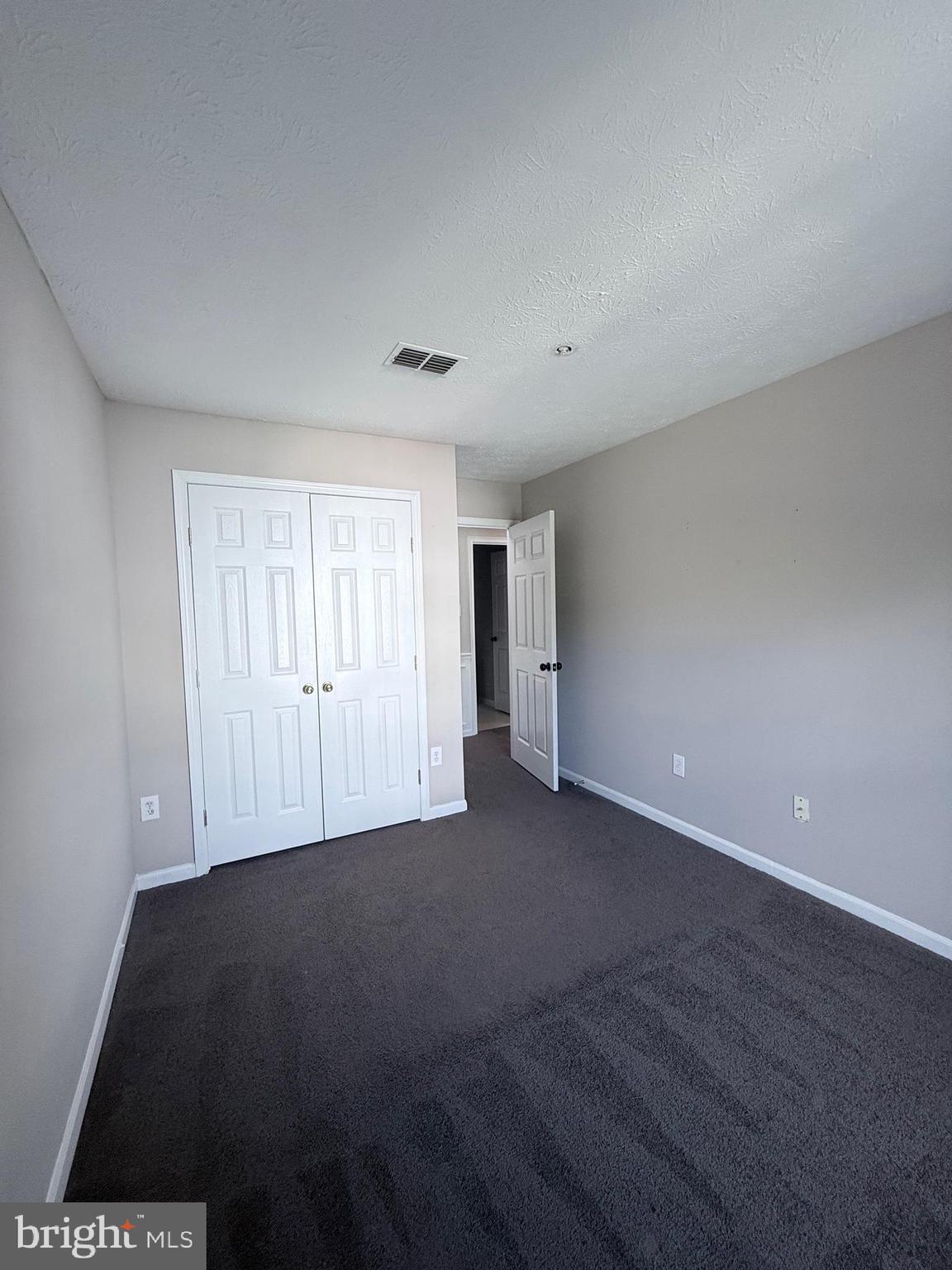 9216 Leigh Choice Court, Unit 10 Owings Mills, MD 21117 - Photo 20 of 32 a view of an empty room with a window