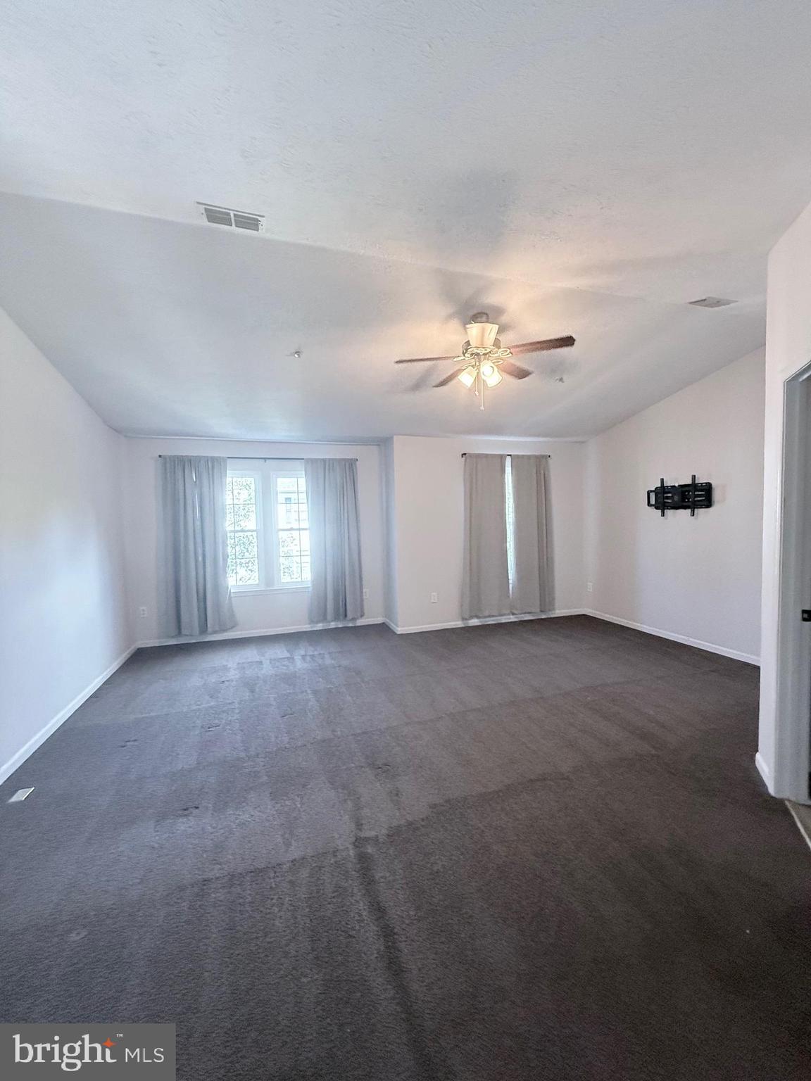 9216 Leigh Choice Court, Unit 10 Owings Mills, MD 21117 - Photo 24 of 32 a view of a livingroom with a ceiling fan and window