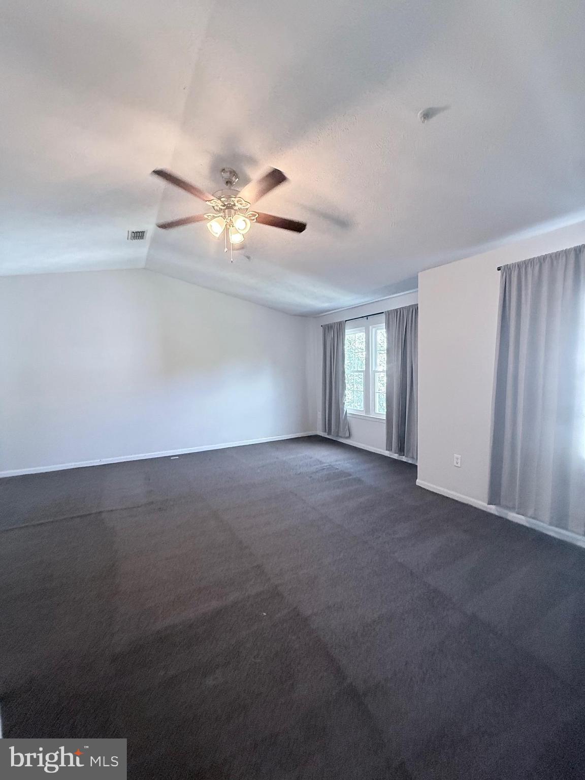 9216 Leigh Choice Court, Unit 10 Owings Mills, MD 21117 - Photo 27 of 32 a view of an empty room with a window
