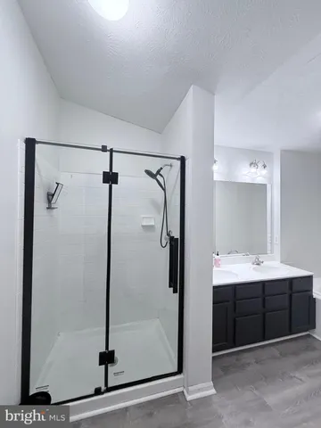 a bathroom with a tub a sink and a toilet