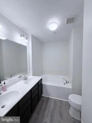 a white bath tub sitting in a bathroom