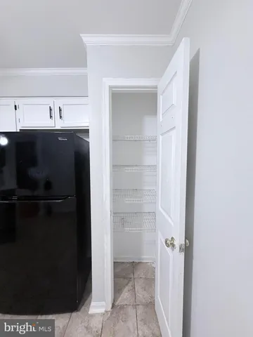 a kitchen with a sink and refrigerator